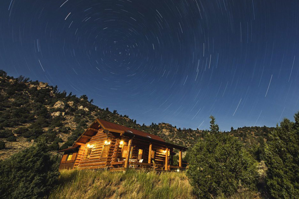 A Bar A Ranch cabin at night
