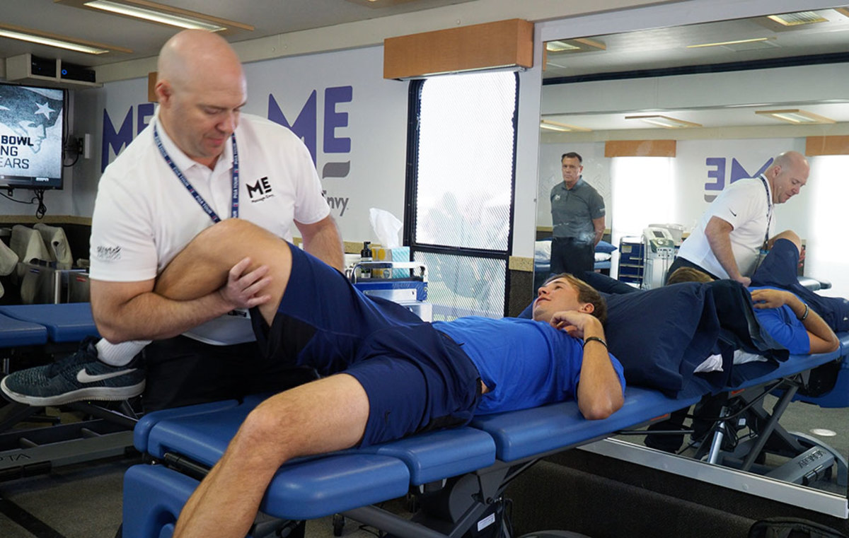 Trainer Corey Hug working on PGA Golfer Smylie Kaufman in the Player Performance Center.