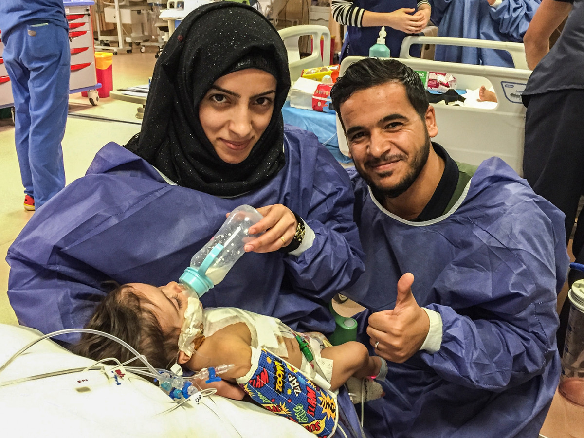 Parents Ashmaq and Saif, after their eight-month-old son's successful heart surgery