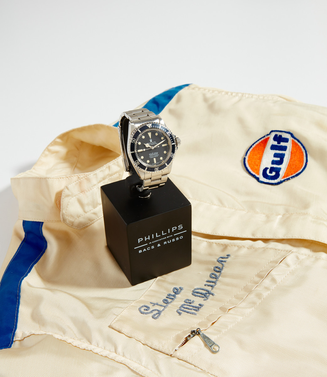 A Rolex Submariner that once belonged to Steve McQueen, along with the actor's personalized racing jumpsuit.