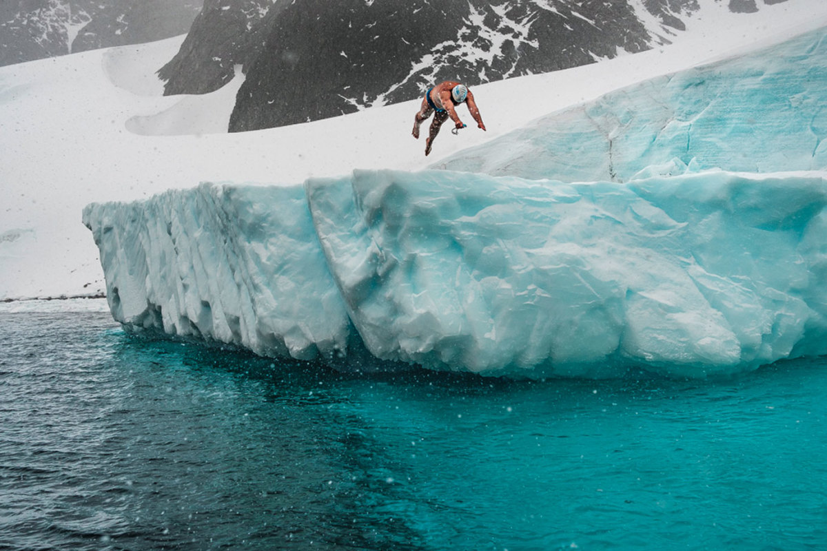 Lewis Pugh diving off an iceburg in Antarctica in 2017