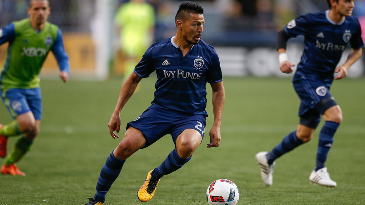 Roger Espinoza #27 of Sporting Kansas City dribbles against the Seattle Sounders FC at CenturyLink Field on March 6, 2016 in Seattle, Washington.
