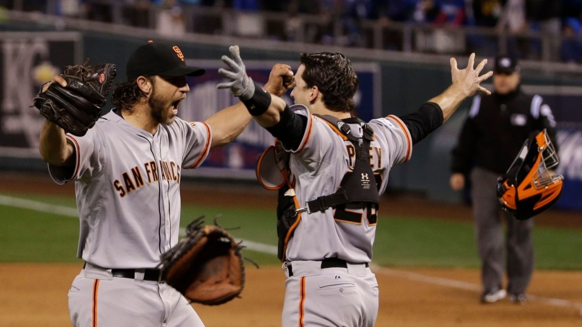 E Games of the Year Baseball, Kansas City, USA San Francisco Giants pitcher Madison Bumgarner, left, and Buster Posey celebrate after winning 3-2 to win the series over Kansas City Royals after Game 7 of baseball's World Series in Kansas City, Mo 29 Oct 2014 Image ID: 6113188a Featured in: YE Games of the Year Baseball, Kansas City, USA Photo Credit: Matt Slocum/AP/Shutterstock