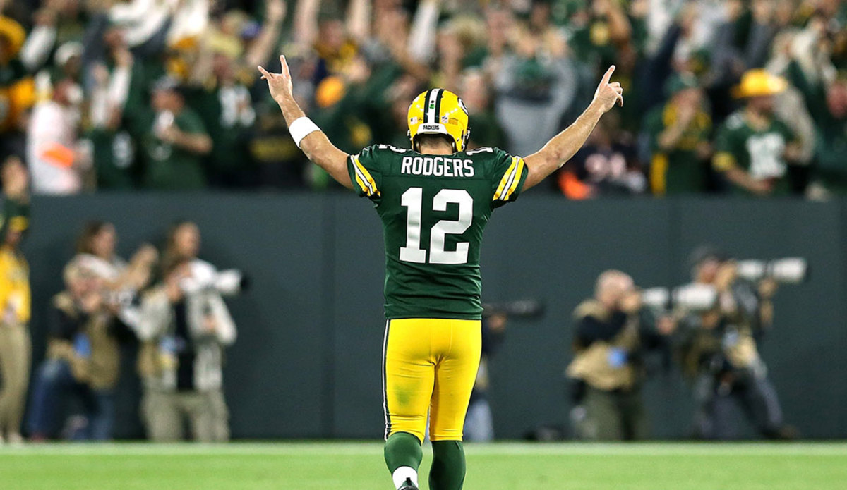 Aaron Rodgers #12 of the Green Bay Packers reacts after throwing a touchdown pass to Randall Cobb #18 during the fourth quarter of a game against the Chicago Bears at Lambeau Field on September 9, 2018 in Green Bay, Wisconsin. (Photo by Dylan Buell/Getty Images)