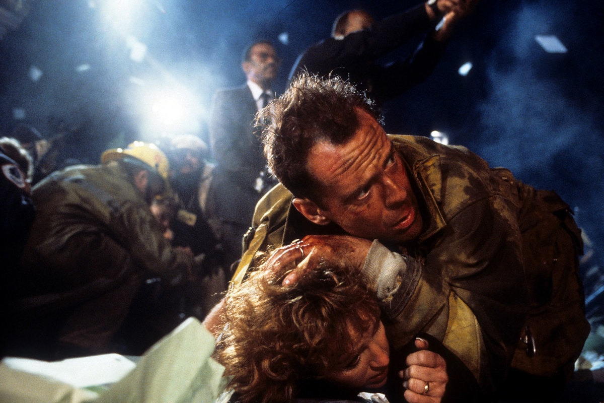 Bonnie Bedelia is held down by Bruce Willis in a scene from the film 'Die Hard', 1988. (Photo by 20th Century-Fox/Getty Images)