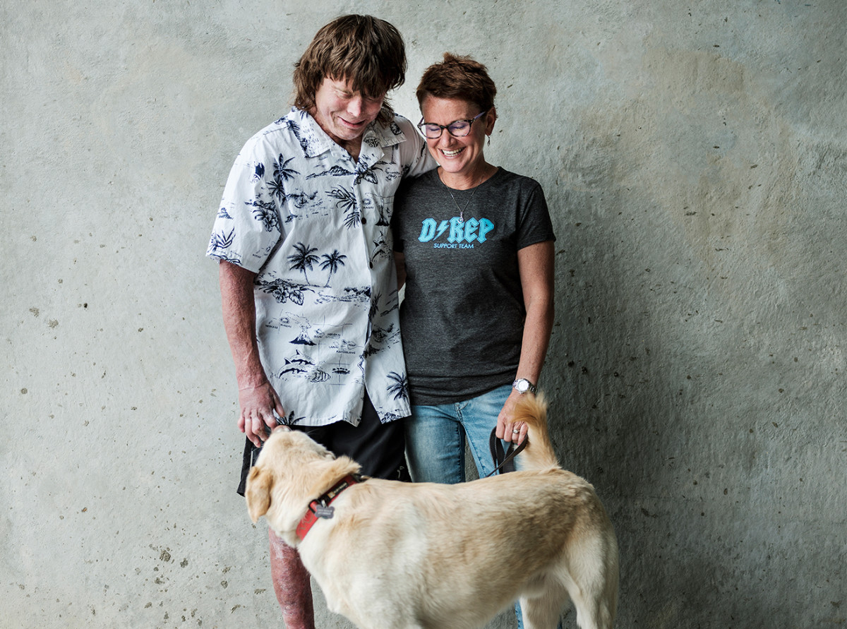 Repsher, who has undergone 51 surgeries since the crash, with his wife, Amanda, and dog, Turq.