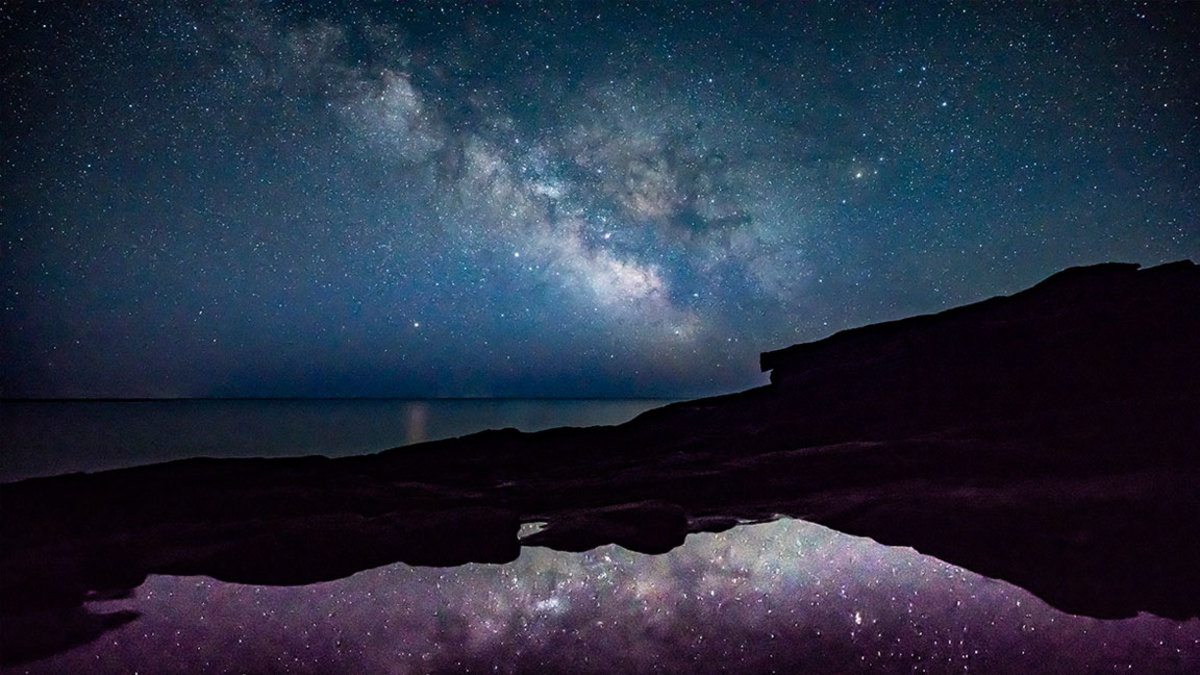 The Milky Way shines above the ocean off the coast of Acadia National Park in the early morning hours of Monday, April 23, 2018. Night skies in northern Maine consistently place first in a rating of darkness, meaning there is less light pollution and allowing more stars and planets to be seen. Parks like Acadia, Katahdin Woods & Waters National Monument as well as the Appalachian Mountain Club, which has land holdings in the 100-mile wilderness area, are hoping to boost astrotourism by becoming receiving a dark-sky designation from the International Dark-Sky Association. (Staff photo by Gregory Rec/Portland Press Herald via Getty Images)