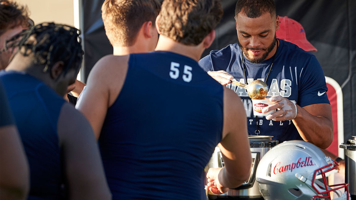 Dallas Cowboys Dak Prescott surprises high school football team with Campbell's Chunky Soup on September 17, 2018 in Frisco, Texas. (Photo by Cooper Neill/Getty Images for Campbell's Chunky Soup)