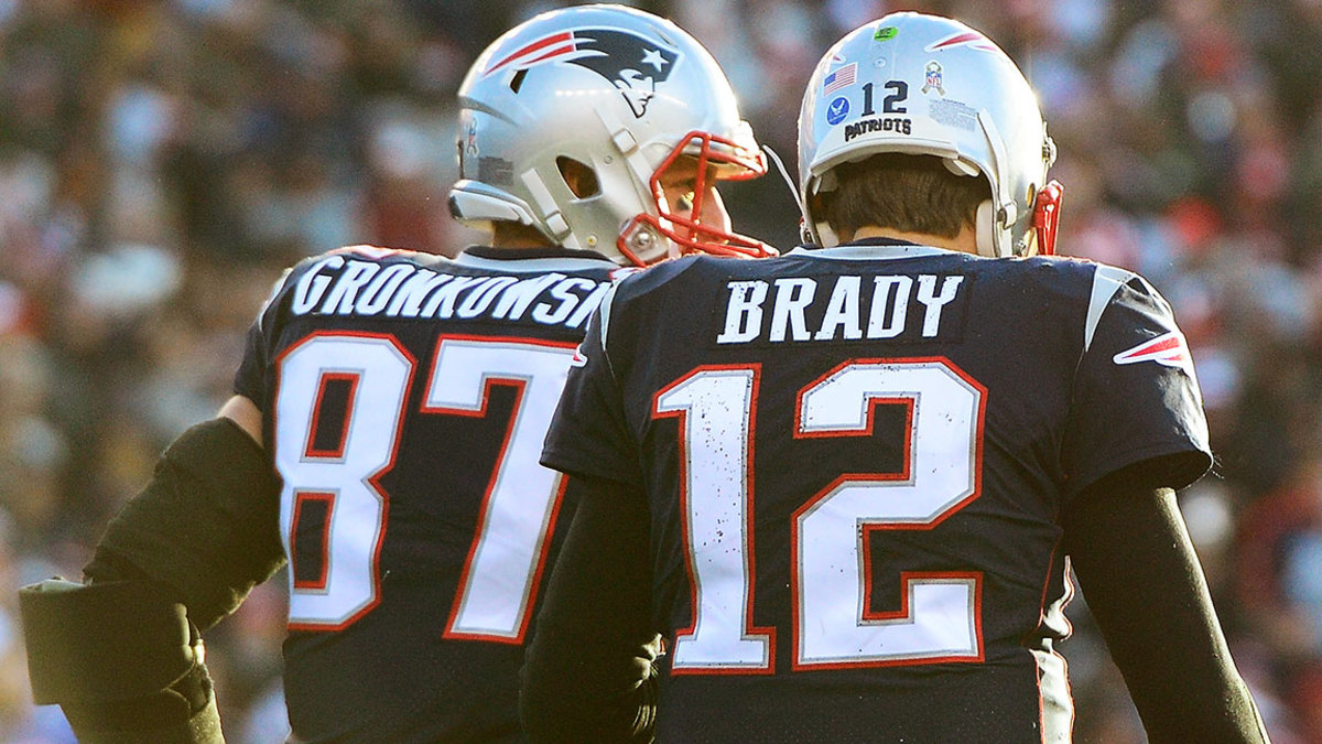 Rob Gronkowski #87 of the New England Patriots reacts with Tom Brady #12 after catching a touchdown pass during the third quarter of a game against the Miami Dolphins at Gillette Stadium on November 26, 2017 in Foxboro, Massachusetts. (Photo by Adam Glanzman/Getty Images)