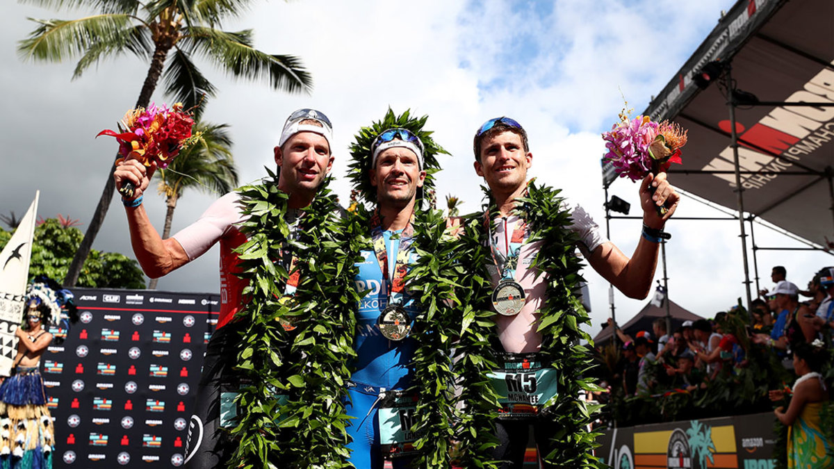 Bart Aernouts of Belgium (2nd place), Patrick Lange of Germany (1st place) and David McNamee of Great Britain (3rd place) celebrate after the IRONMAN World Championships brought to you by Amazon on October 13, 2018 in Kailua Kona, Hawaii. (Photo by Al Bello/Getty Images for IRONMAN)