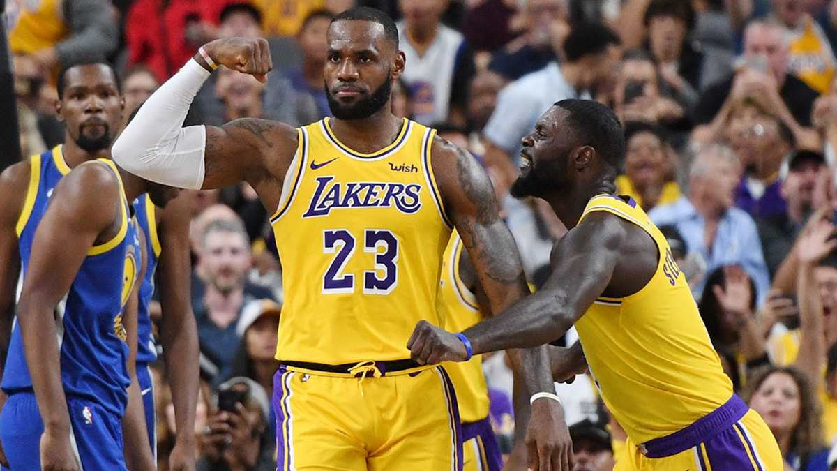 LeBron James #23 and Lance Stephenson #6 of the Los Angeles Lakers celebrate after James made a shot against the Golden State Warriors and was fouled during their preseason game at T-Mobile Arena on October 10, 2018 in Las Vegas, Nevada. The Lakers defeated the Warriors 123-113.