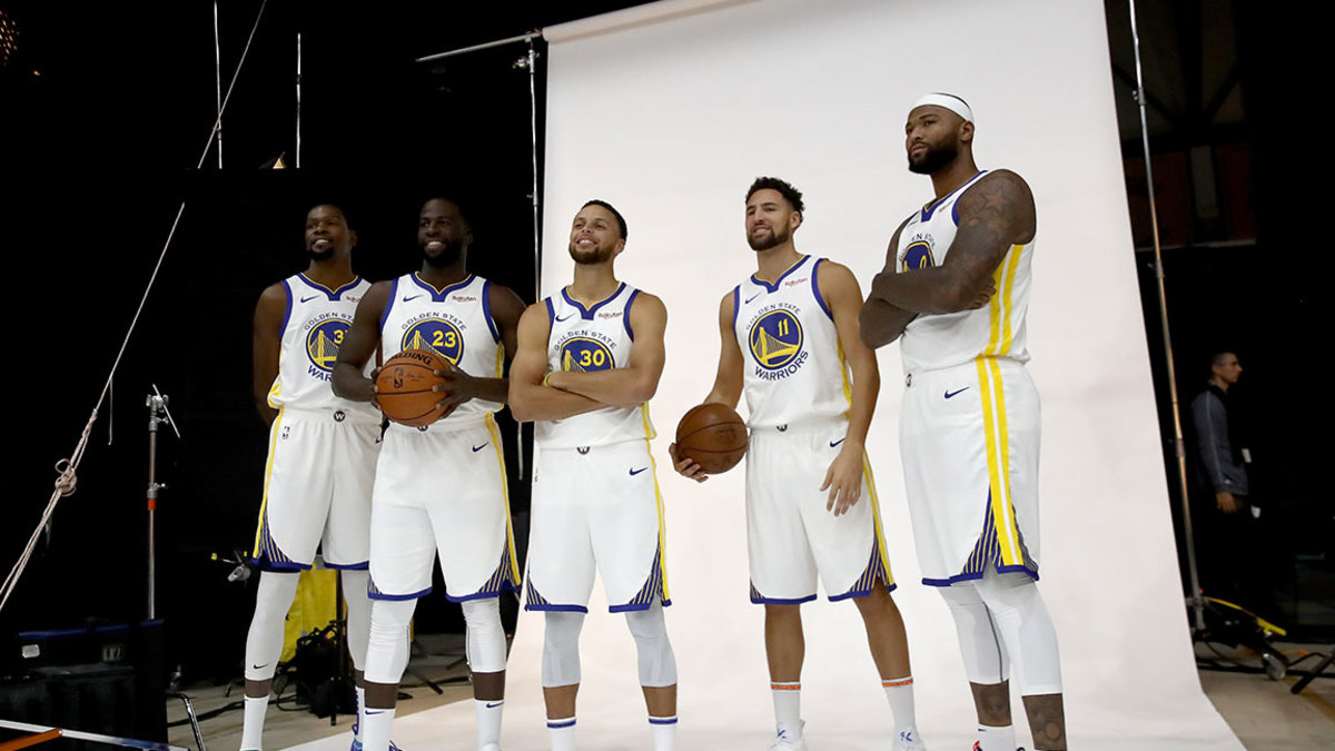 Kevin Durant #35, Draymond Green #23, Stephen Curry #30, Klay Thompson #11, and DeMarcus Cousins #0 of the Golden State Warriors pose for a group picture during the Golden State Warriors media day on September 24, 2018 in Oakland, California. (Photo by Ezra Shaw/Getty Images)