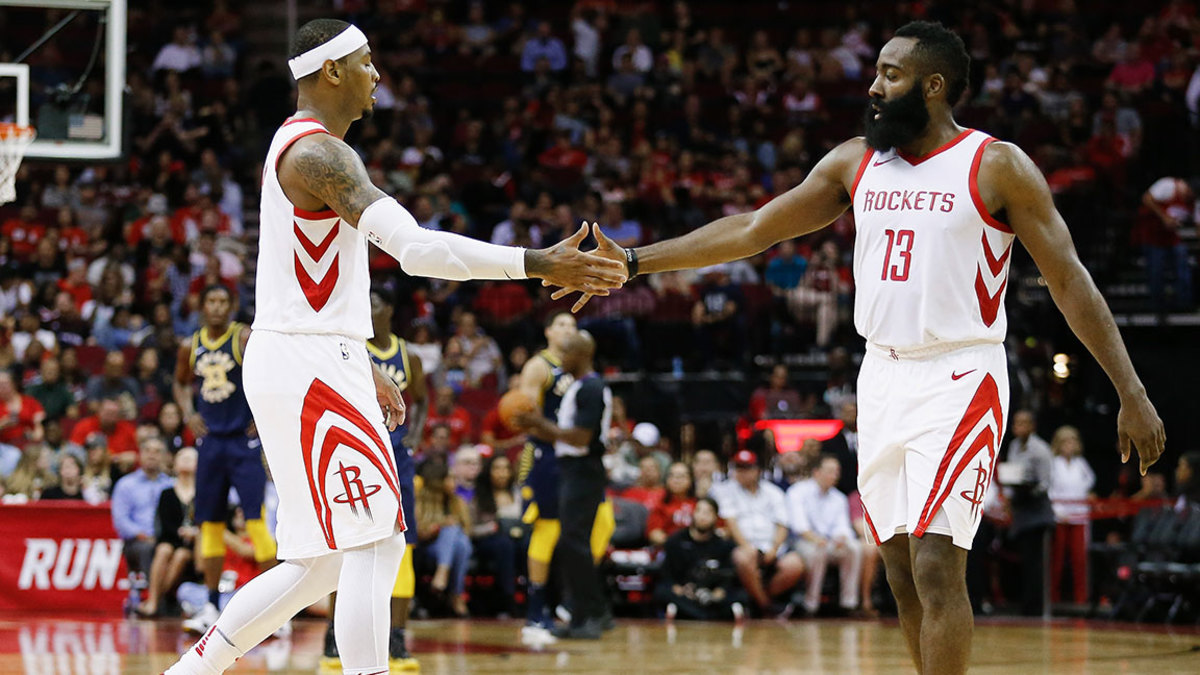 James Harden #13 of the Houston Rockets shakes hands with Carmelo Anthony #7 against the Indiana Pacers at Toyota Center on October 4, 2018 in Houston, Texas. 