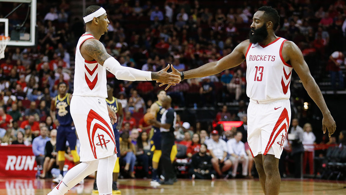 James Harden #13 of the Houston Rockets shakes hands with Carmelo Anthony #7 against the Indiana Pacers at Toyota Center on October 4, 2018 in Houston, Texas.