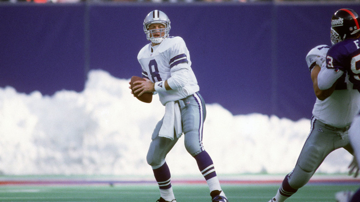 Quarterback Troy Aikam #8 of the Dallas Cowboys drops back to pass against the New York Giants during an NFL football game January 2, 1994 at Giants Stadium in East Rutherford, New Jersey. Aikman played for the Cowboys from 1989-00. (Photo by Focus on Sport/Getty Images)