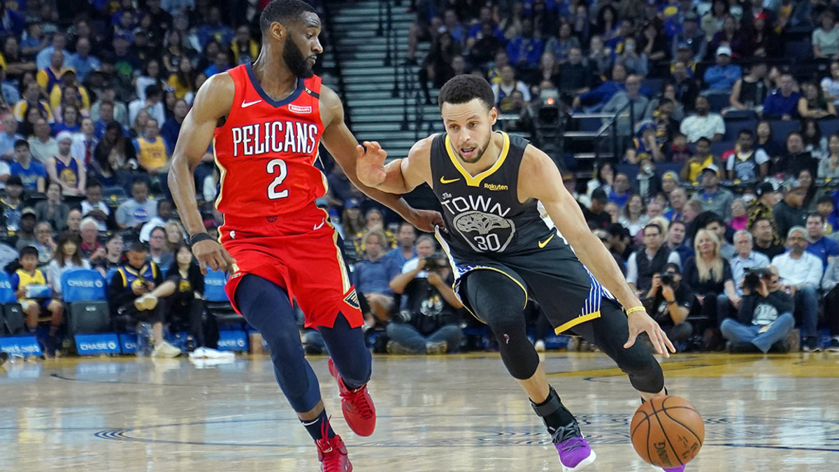 Stephen Curry #30 of the Golden State Warriors drives on Ian Clark #2 of the New Orleans Pelicans during an NBA basketball game at ORACLE Arena on October 31, 2018 in Oakland, California. NOTE TO USER: User expressly acknowledges and agrees that, by downloading and or using this photograph, User is consenting to the terms and conditions of the Getty Images License Agreement. (Photo by Thearon W. Henderson/Getty Images)