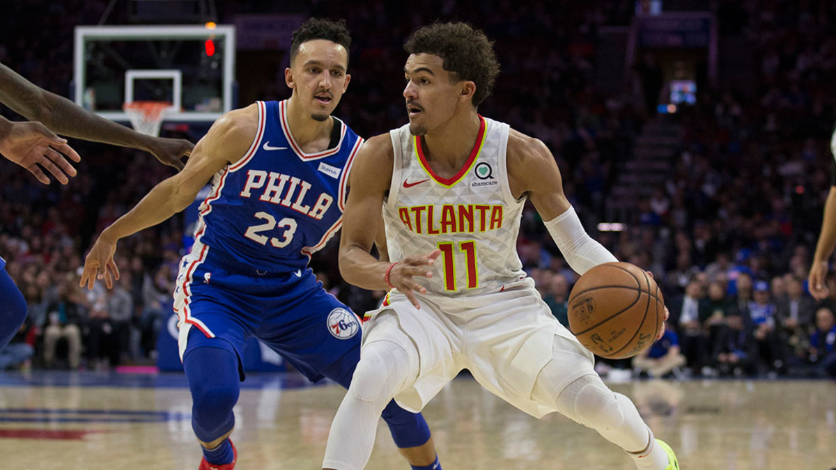Trae Young #11 of the Atlanta Hawks dribbles the ball against Landry Shamet #23 of the Philadelphia 76ers at the Wells Fargo Center on October 29, 2018 in Philadelphia, Pennsylvania. NOTE TO USER: User expressly acknowledges and agrees that, by downloading and or using this photograph, User is consenting to the terms and conditions of the Getty Images License Agreement. (Photo by Mitchell Leff/Getty Images)
