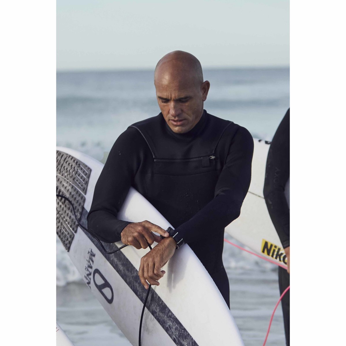 Breitling Surfers Squad member Kelly Slater wearing his Superocean Heritage II Chronograph 44 Outerknown