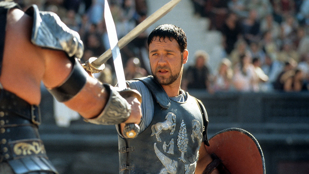 Russell Crowe facing off against another man in a scene from the film 'Gladiator', 2000. (Photo by Universal/Getty Images)