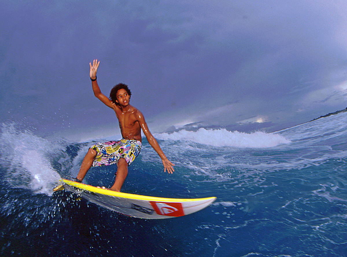 Michael February surfing as a kid in Africa
