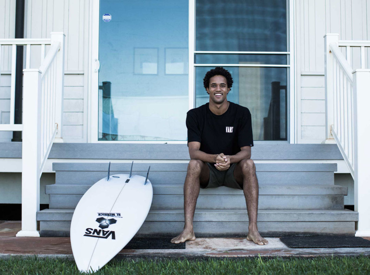 Michael February sitting in front of Vans Pipeline House