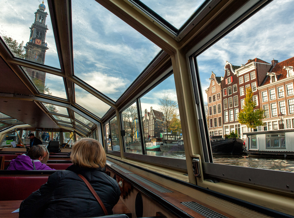 Amsterdam view from the interior of a canal cruise boat.