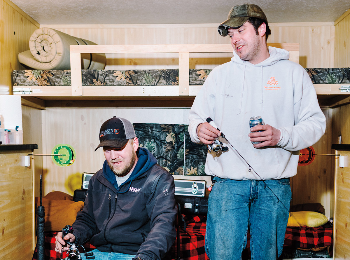 Anglers in a heated ice-fishing shack.