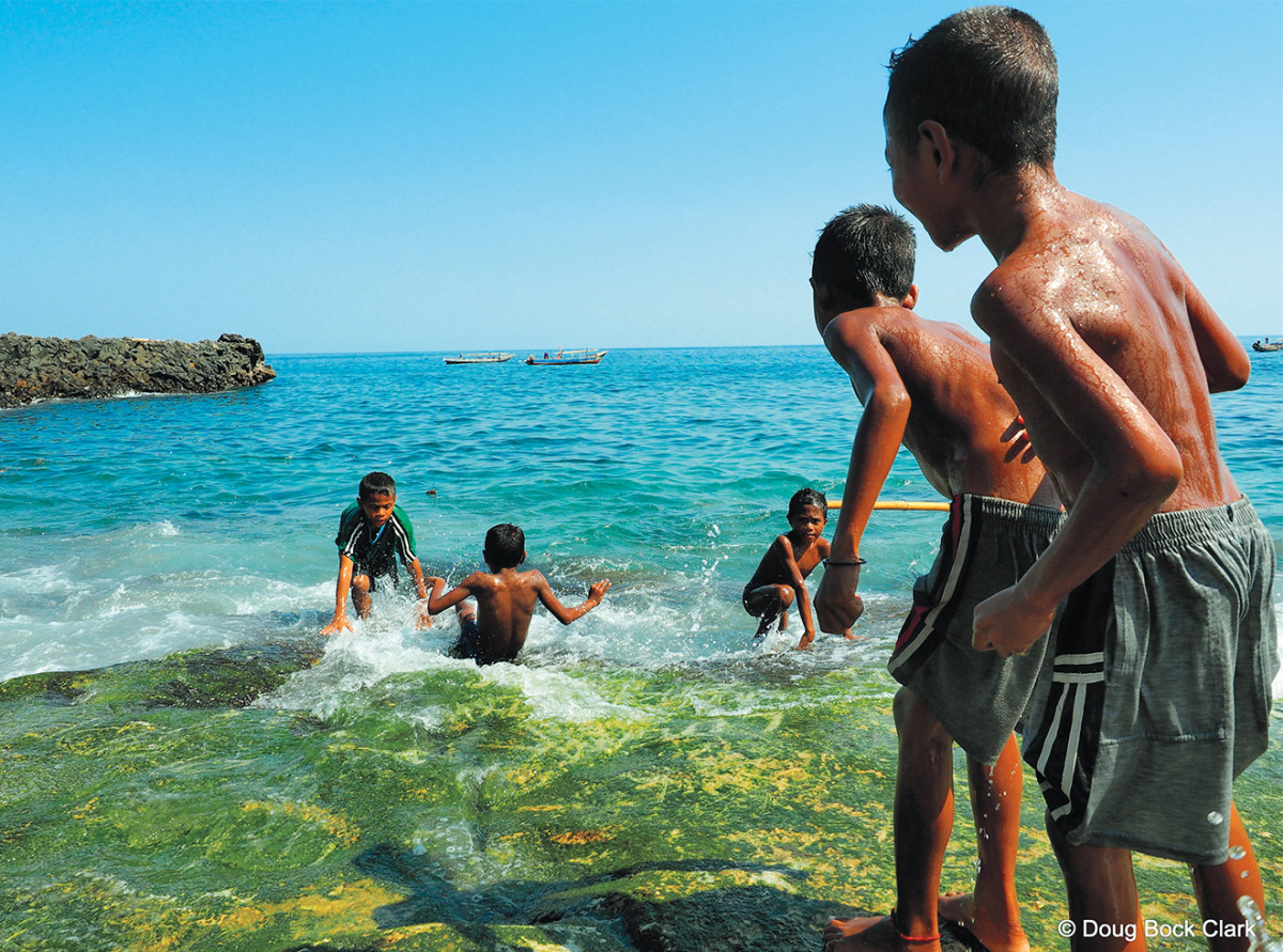The next generation of lamafas play on Lamalera Beach.