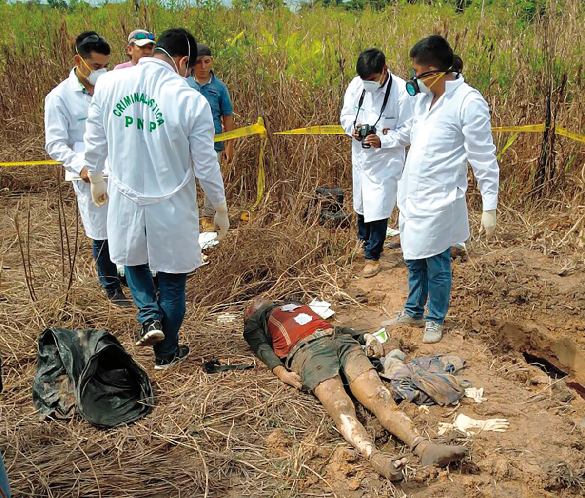 Authorities examining Sebastian Woodroffe's body.