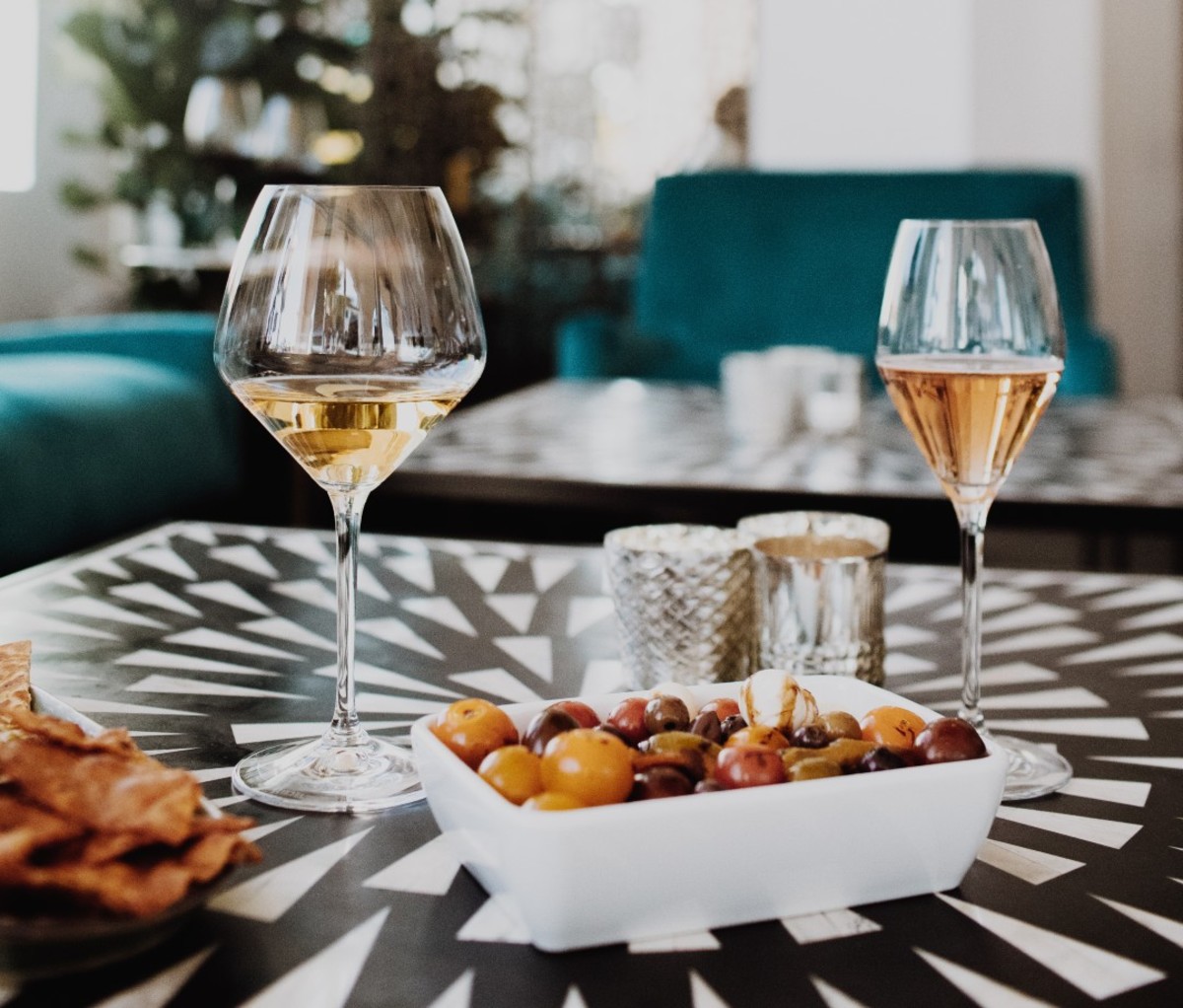 Glasses of white wine on geometric table