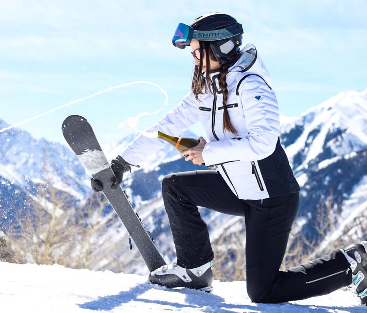 Sabering champagne bottle with a ski