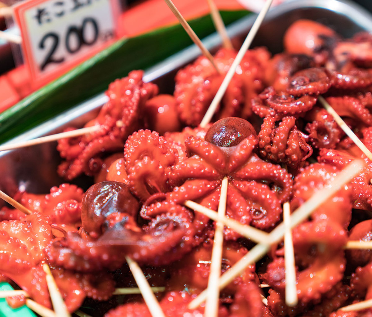 Small squid on skewers for sale at Nishiki Market, Kyoto, Japan