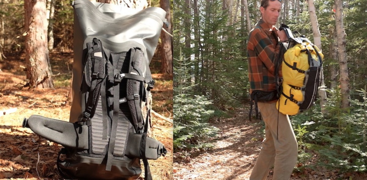 A paddler displays a portage pack
