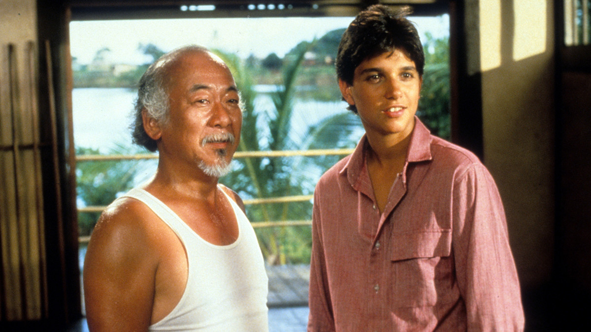 Pat Morita and Ralph Macchio in a scene from the film 'The Karate Kid', 1984. (Photo by Columbia Pictures/Getty Images)