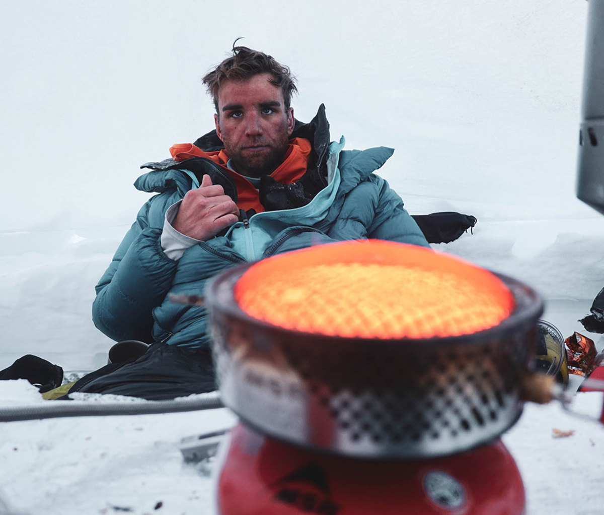 Mike Chambers warms up after Denali descent with 70 mph winds