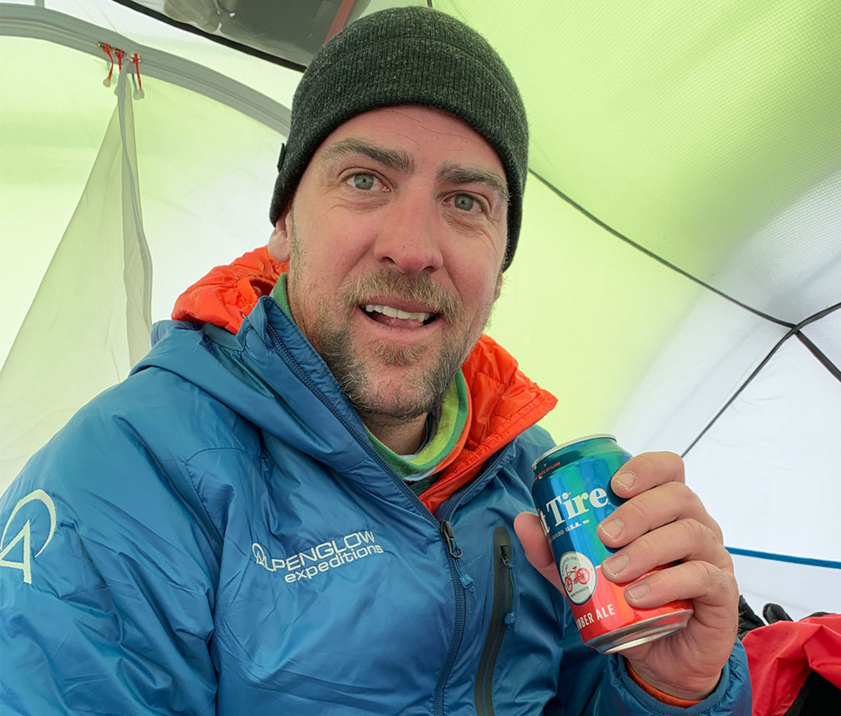 Rob Lea drinking Fat Tire beer at Everest camp