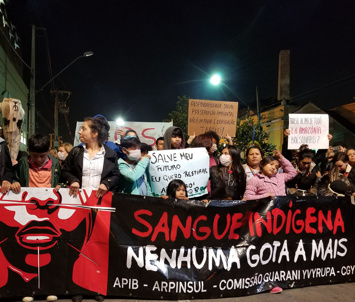 Protesters in Curitiba, Brazil, decry the Amazon fires and their impact on indigenous peoples