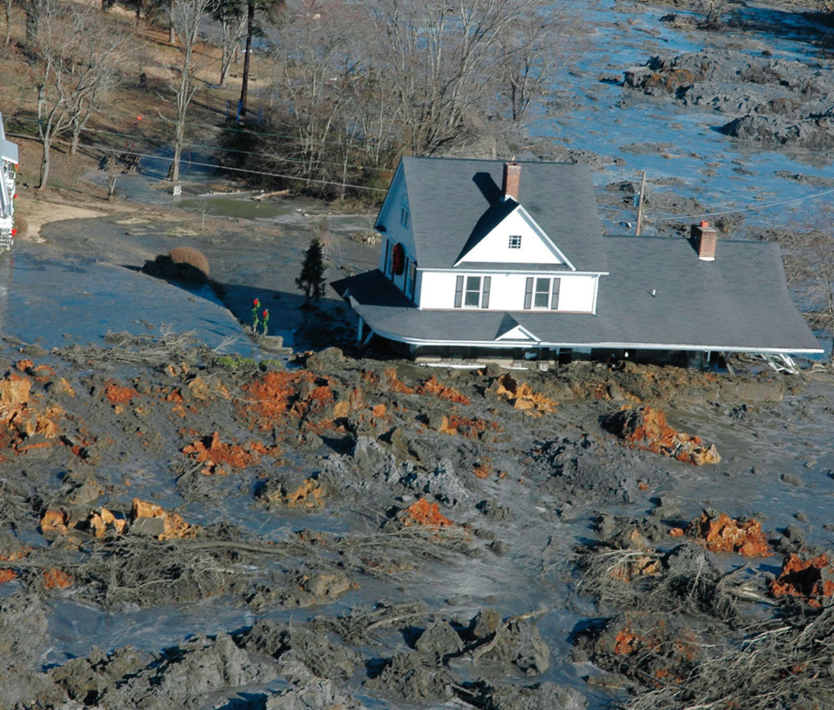 A home buried in coal ash following the 2008 Kingston Fossil Plant spill.