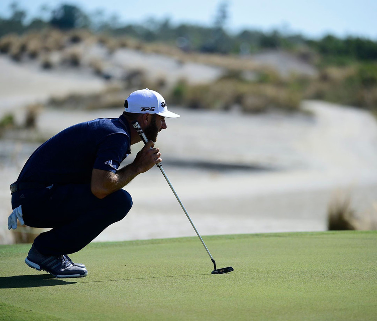 Dustin Johnson lines up a putt at the Hero World Challenge in Nassau, Bahamas