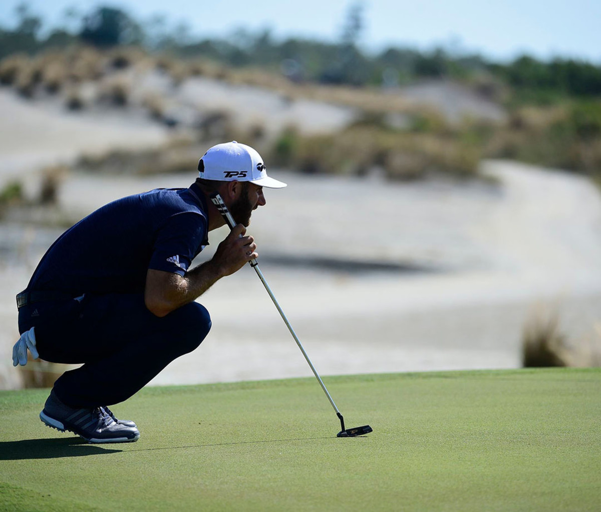 Dustin Johnson lines up a putt at the Hero World Challenge in Nassau, Bahamas