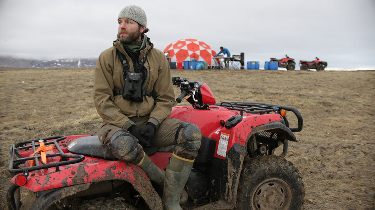 Kingdom of the White Wolf - Eureka, Nunavut, Canada - Ronan Donovan sitting on ATV near base camp. (Market Road Films/Tony Gerber)