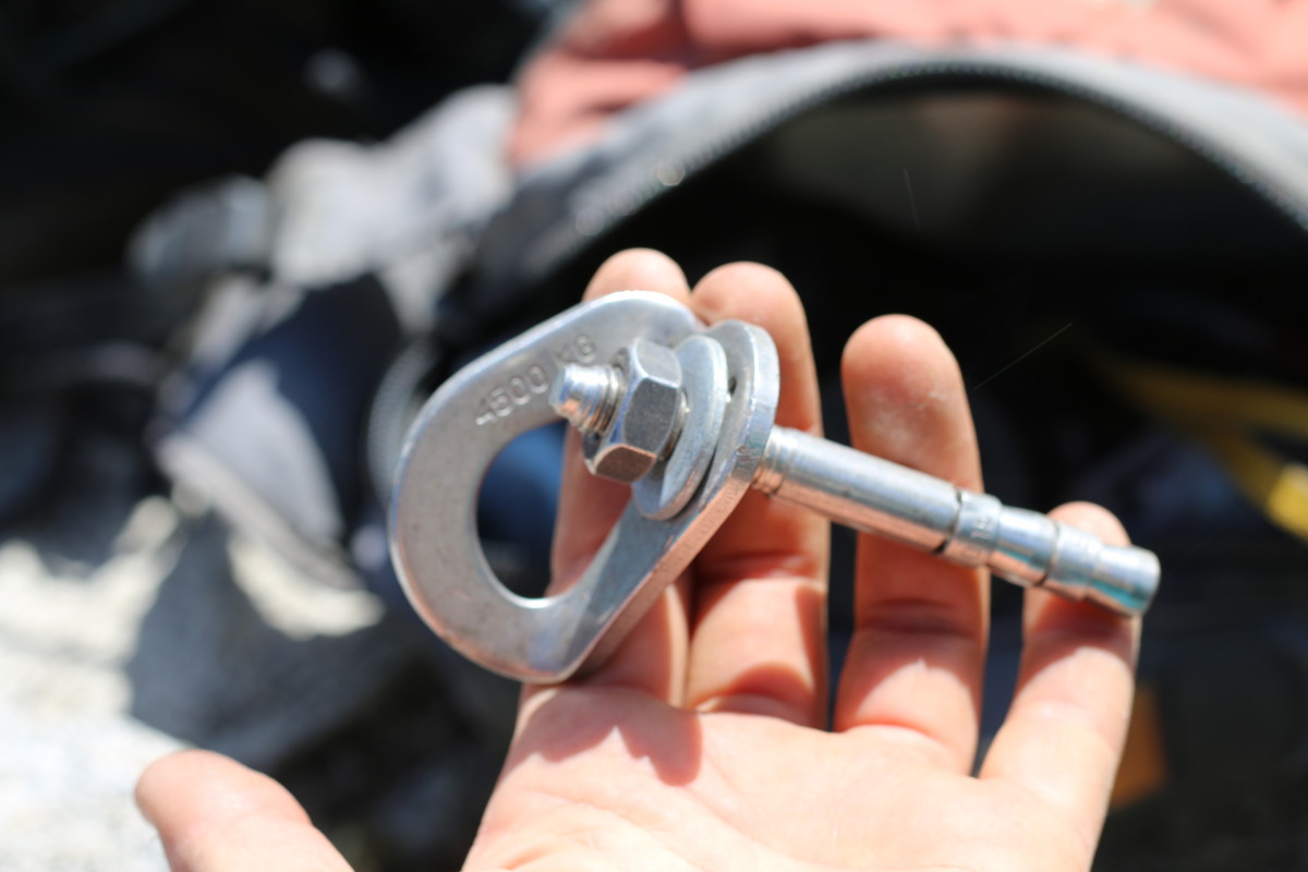 A bolt and a hanger left behind on El Cap