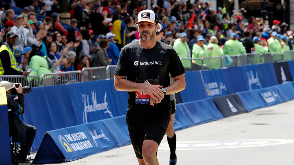 Marathon, Boston, USA - 15 Apr 2019 NASCAR driver Jimmie Johnson, of Charlotte, N.C., finishes the 123rd Boston Marathon, in Boston 15 Apr 2019