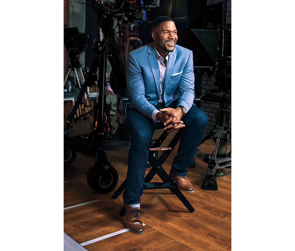 At 47 years old, Michael Strahan experienced the apex of his football career when he was inducted into the 2014 Pro Football Hall of Fame. Jacket, shirt, jeans and shoes by Collection Michael Strahan. Watch by Roger Dubuis.