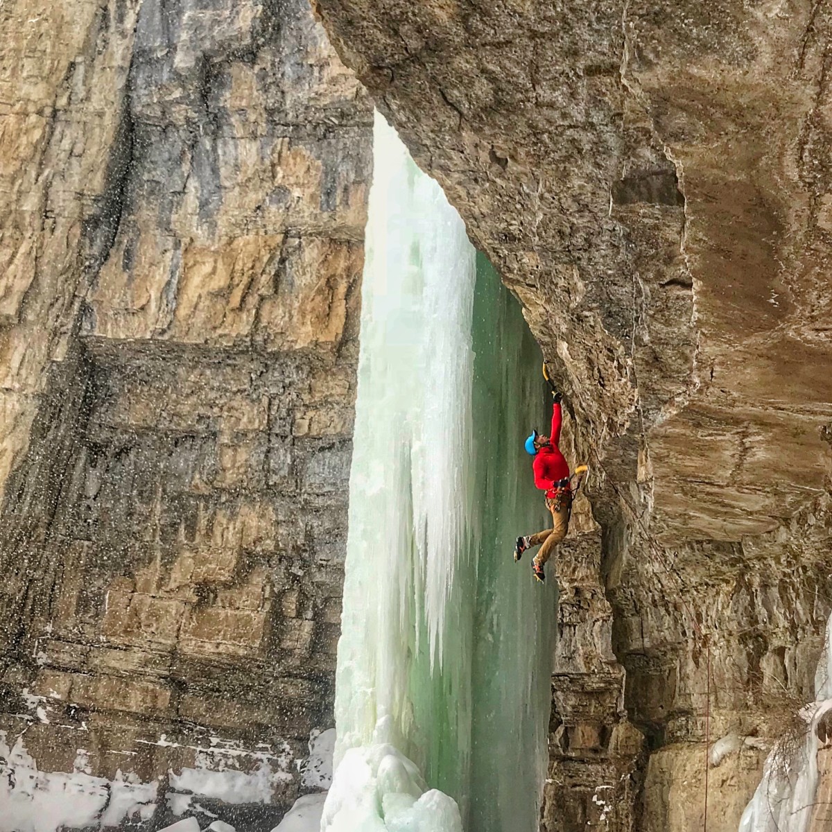 mulkey hanging on his tools on steep rock