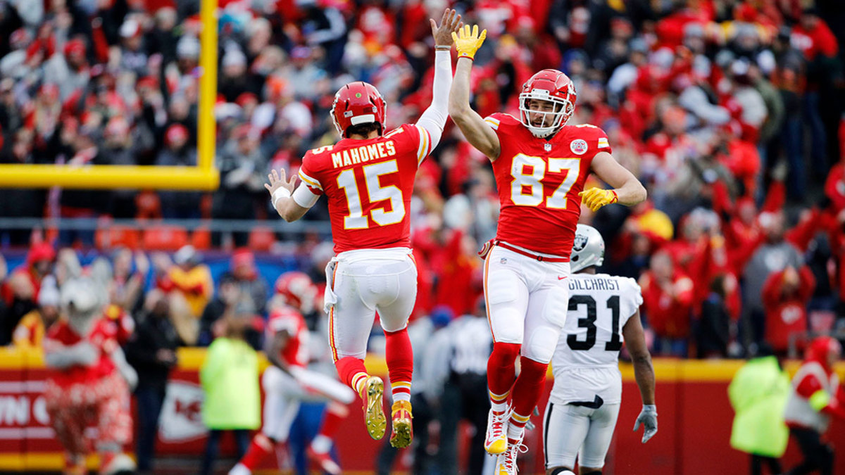 Raiders Chiefs Football, Kansas City, USA - 30 Dec 2018 Kansas City Chiefs quarterback Patrick Mahomes (15) celebrates with tight end Travis Kelce (87) after throwing a 67-yard touchdown pass to Tyreek Hill during the first quarter of an NFL football game against the Oakland Raiders in Kansas City, Mo., . Mahomes threw for 281 yards in the game, joining Peyton Manning as the only two QB's to reach over 5,000 passing yards and 50 touchdowns from the air in the same season 30 Dec 2018