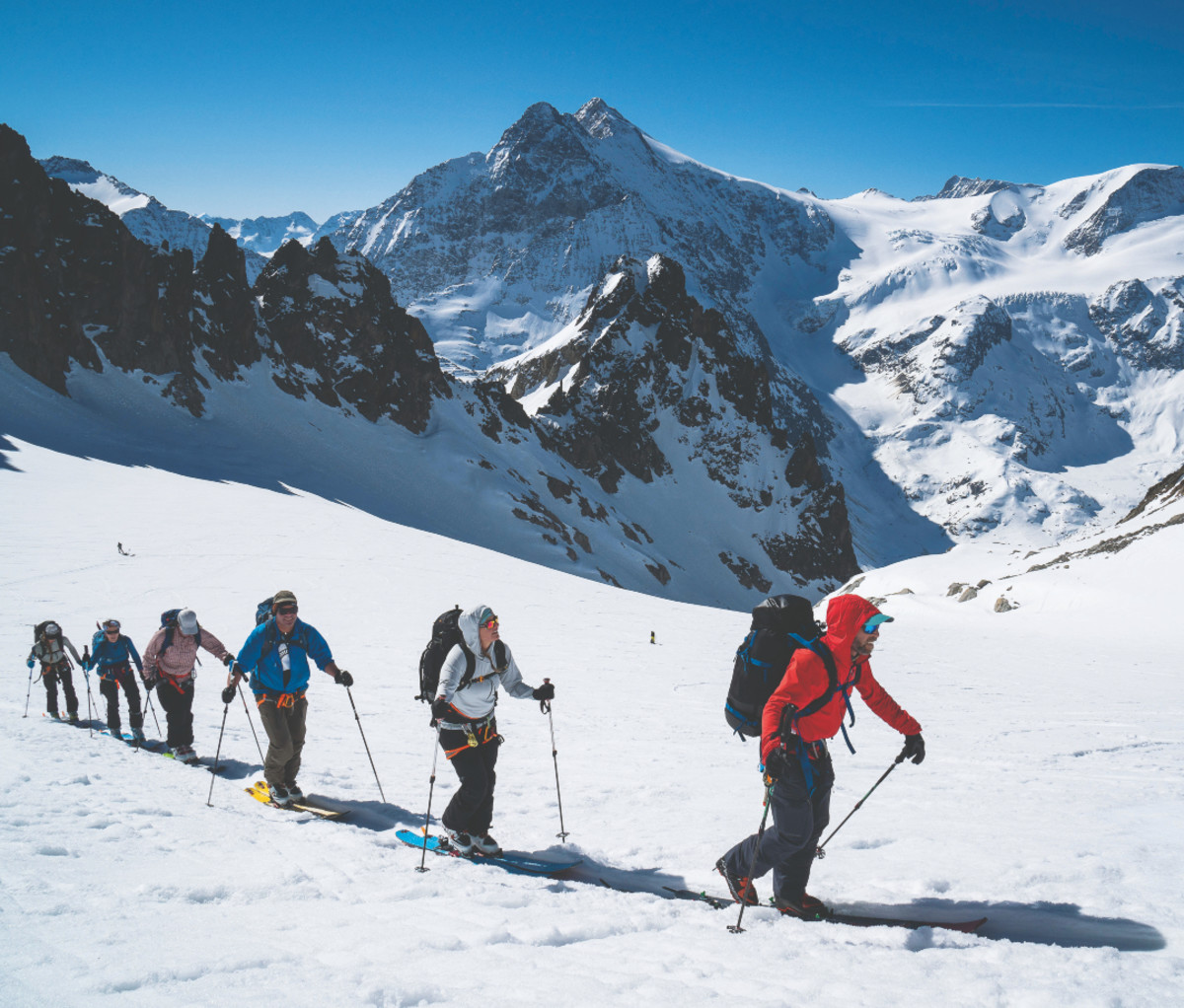 Skinning up a remote col to ski down