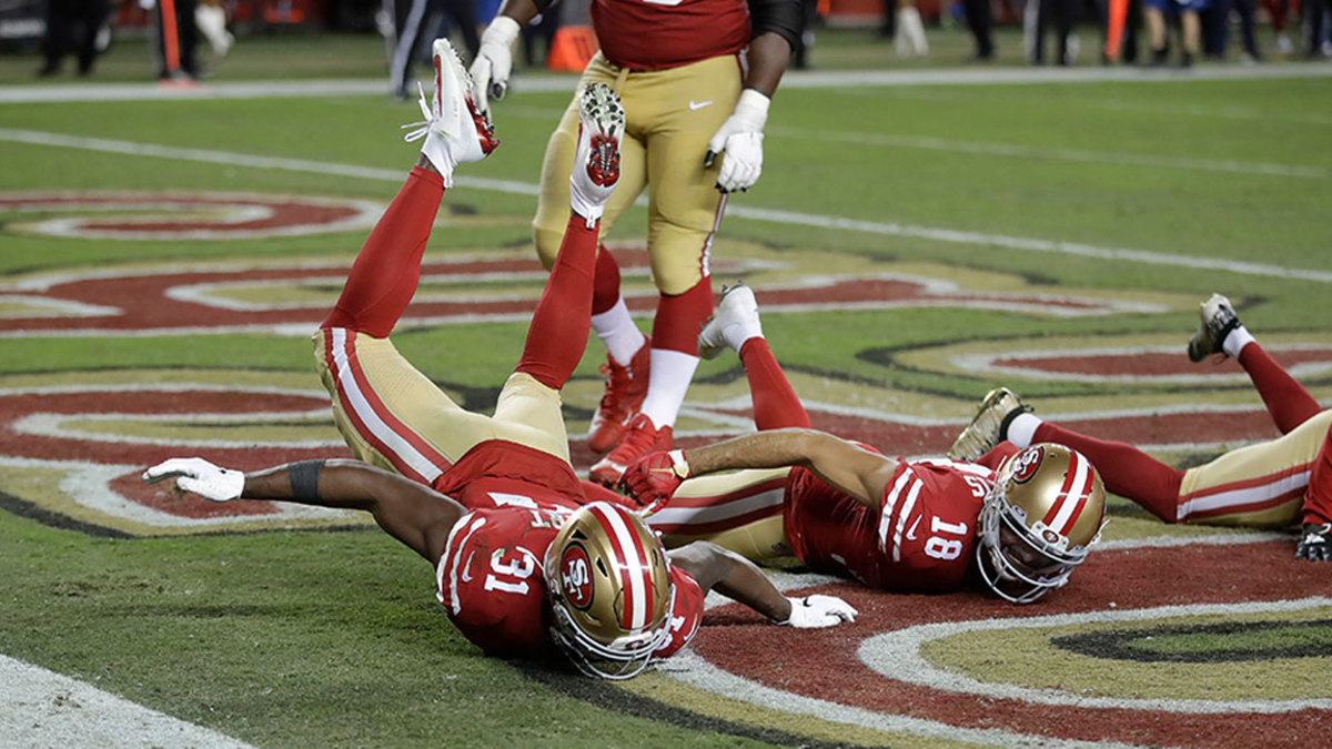 Packers 49ers Football, Santa Clara, USA - 24 Nov 2019 San Francisco 49ers running back Raheem Mostert (31) celebrates after scoring a touchdown with wide receiver Dante Pettis (18) during the second half of an NFL football game against the Green Bay Packers in Santa Clara, Calif 24 Nov 2019