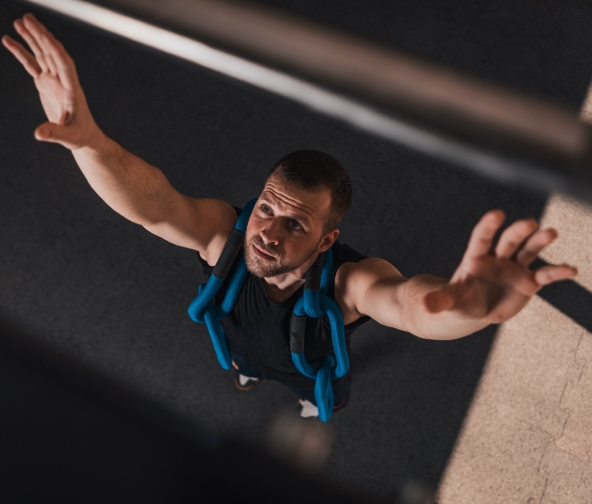Man jumping up to pullup bar
