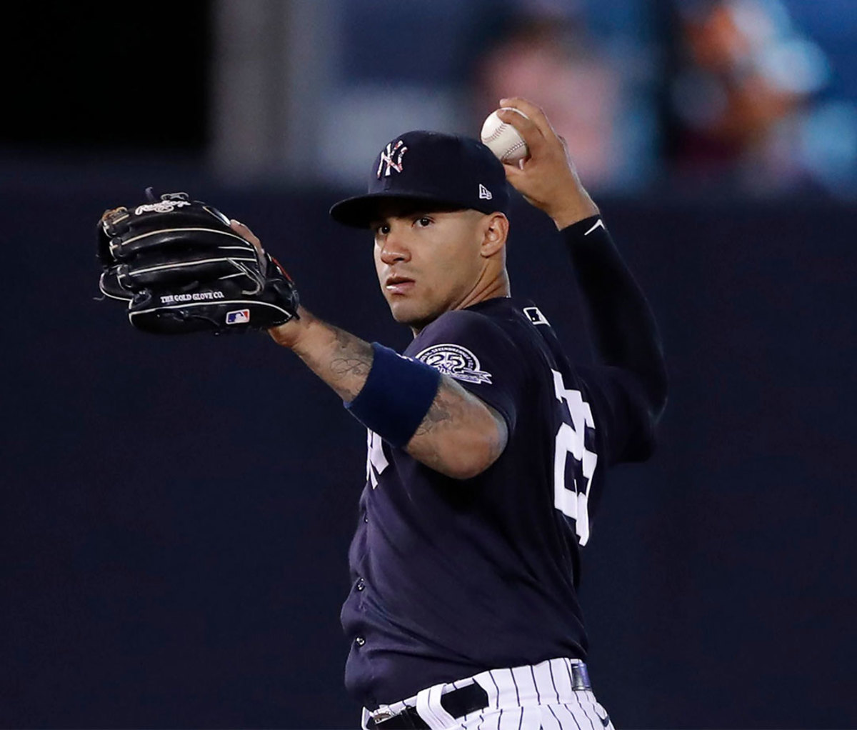 New York Yankees second baseman Gleyber Torres throws to first during a spring training baseball game, in Tampa, Fla